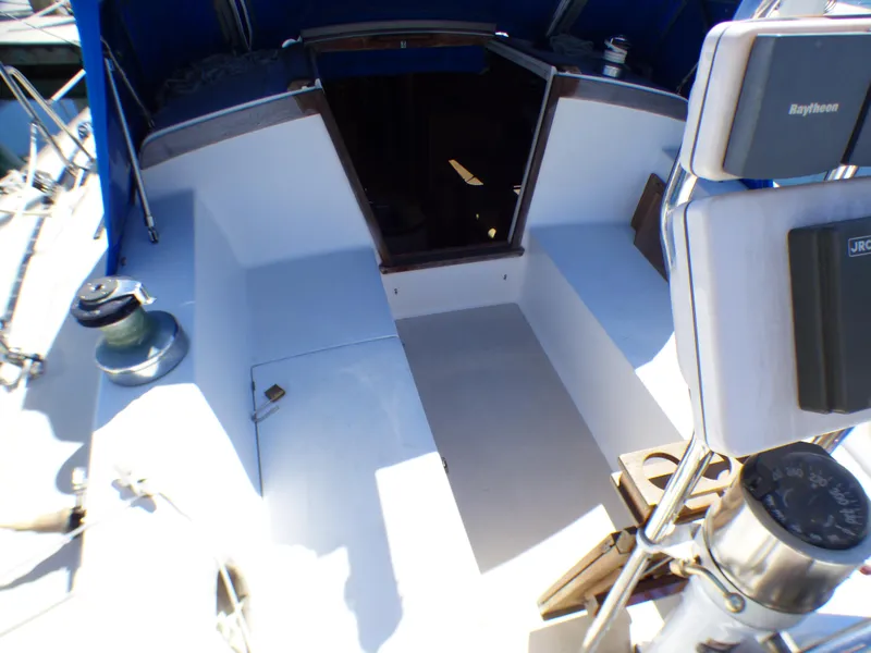 Cockpit of 1984 Catalina 36 Sloop with navigation equipment and open companionway.