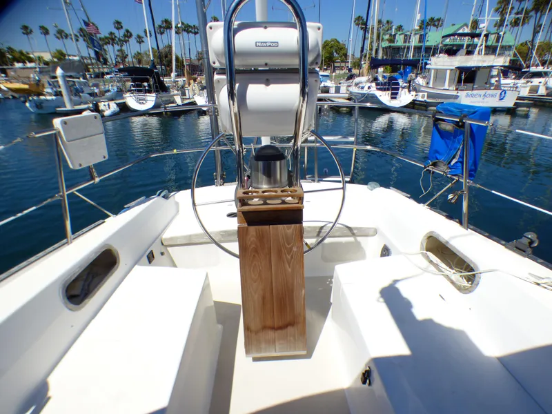 Cockpit of 1984 Catalina 36 Sloop with steering wheel, docked in marina.