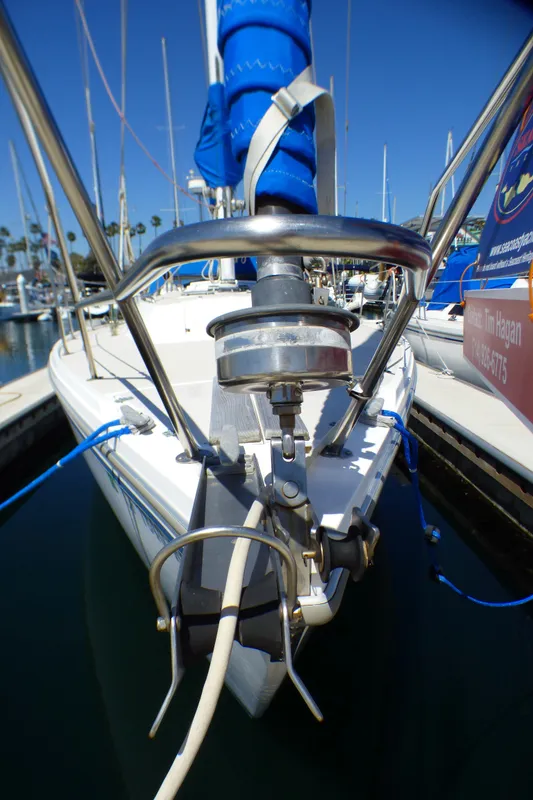 1984 Catalina 36 Sloop sailboat docked, featuring bow and anchor details.
