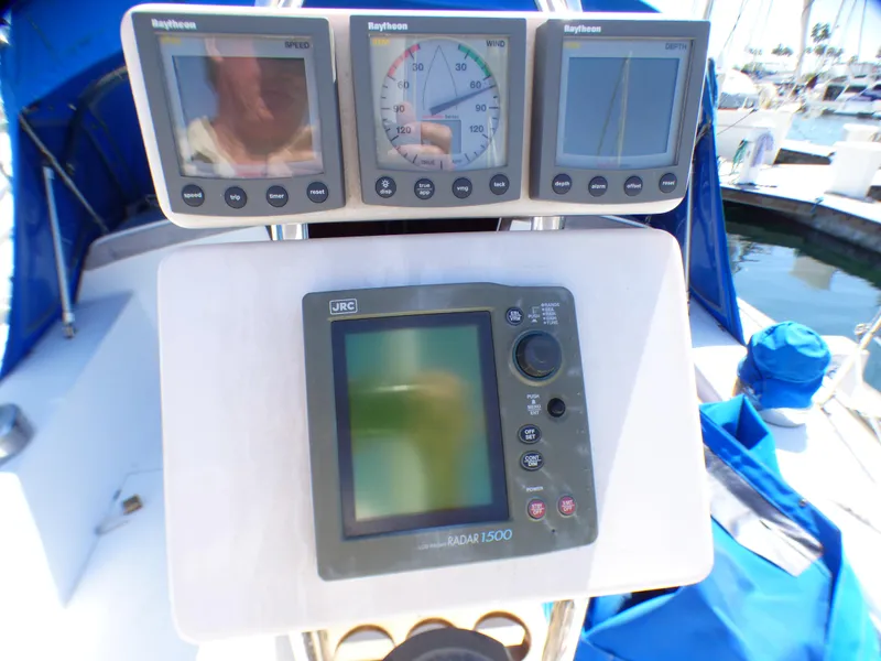 Cockpit instruments on a 1984 Catalina 36 Sloop, featuring Raytheon and JRC displays.