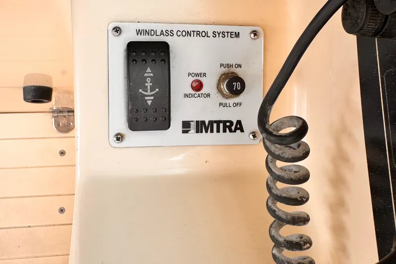 Windlass control system on 2003 Albin 28 TE boat, featuring IMTRA panel and coiled cable.