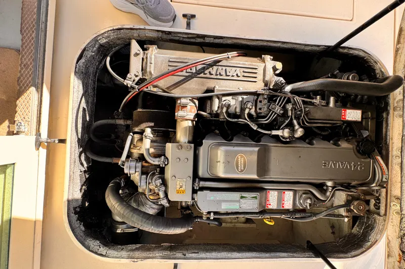 Engine compartment of a 2003 Albin 28 TE boat, featuring a Yanmar diesel engine.