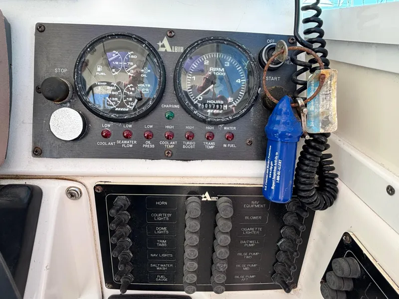 Control panel of a 2004 Albin 28 TE boat with gauges and switches.