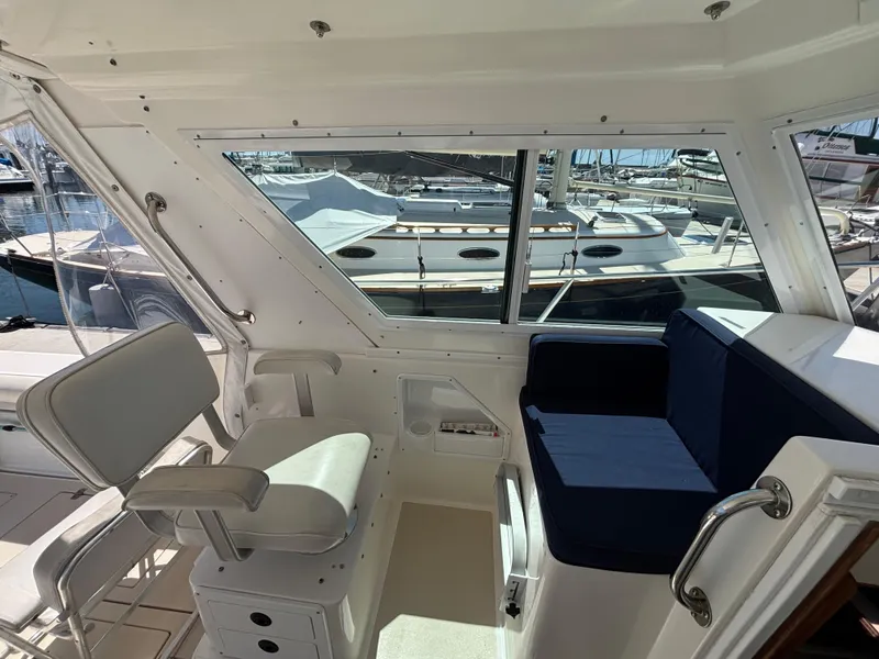 2004 Albin 28 TE boat interior with seating and marina view.