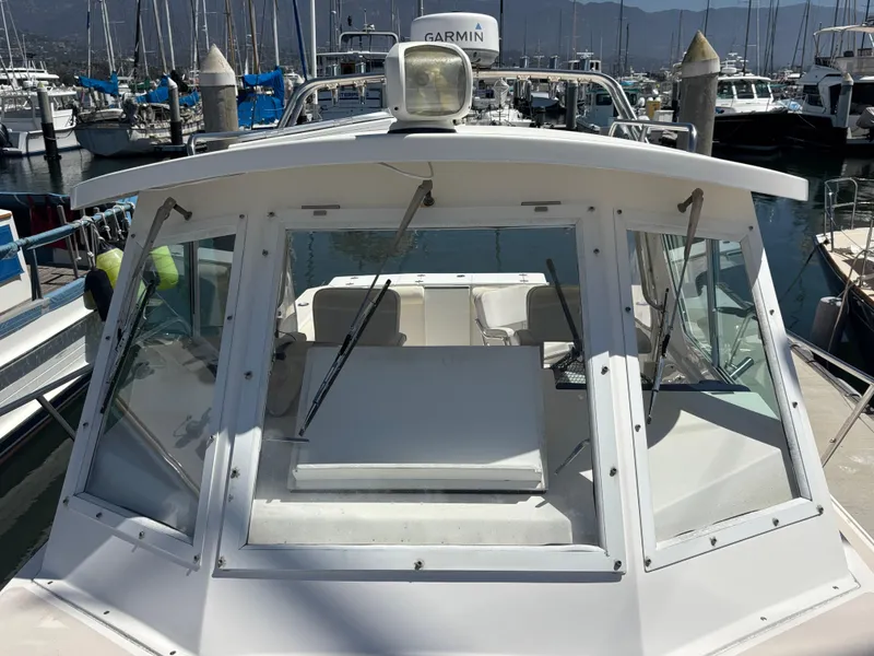 2004 Albin 28 TE boat docked in a marina with clear windshield view.