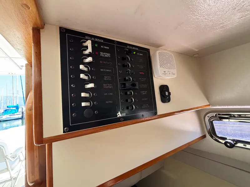 Electrical panel inside 2004 Albin 28 TE boat, featuring various switches and controls.