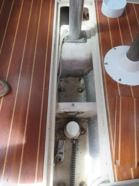 1986 Catalina 34 sailboat interior, showing mast step and wooden flooring details.