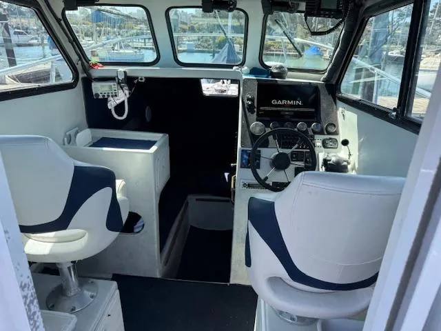 Interior of a 2007 Radon Signature 26 boat with Garmin navigation system.
