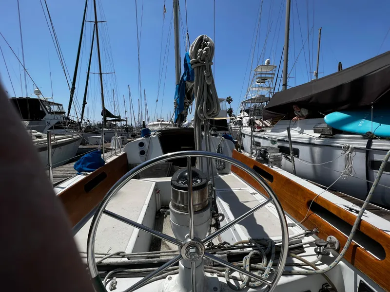 1978 Ericson 35 Sloop sailboat docked at a marina, view from the helm.