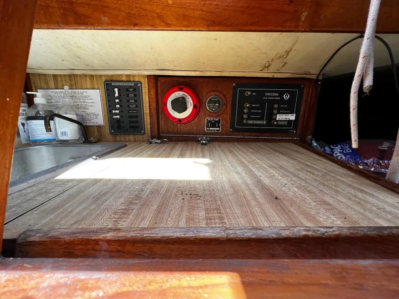 Electrical control panel and sink area inside a 1978 Ericson 35 Sloop sailboat.