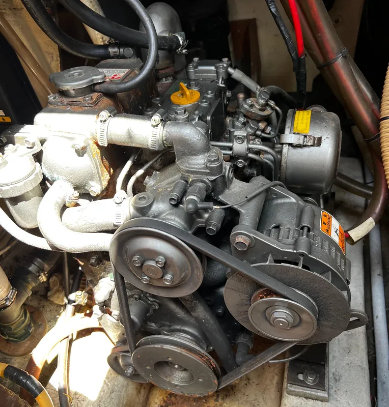 1978 Ericson 35 Sloop engine compartment with visible belts and hoses.