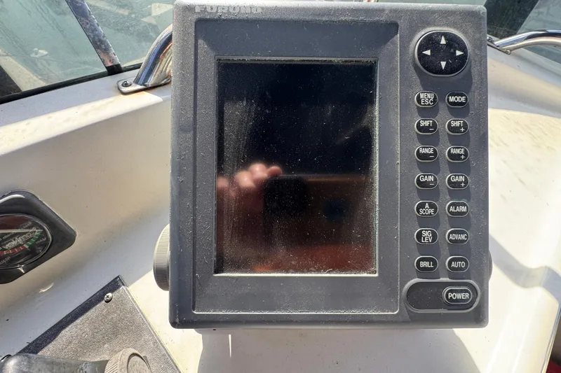 Close-up of a Furuno marine navigation device on a 1977 Tollycraft 37 Convertible boat.