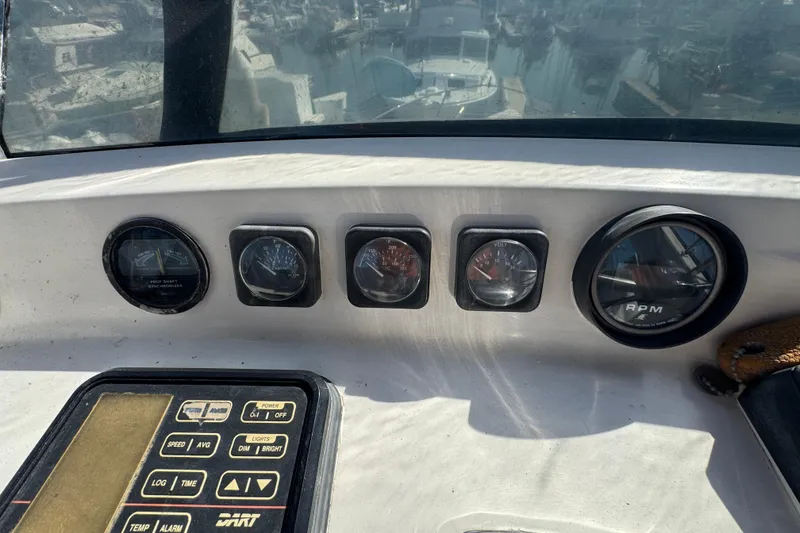 1977 Tollycraft 37 Convertible dashboard with gauges and control panel.