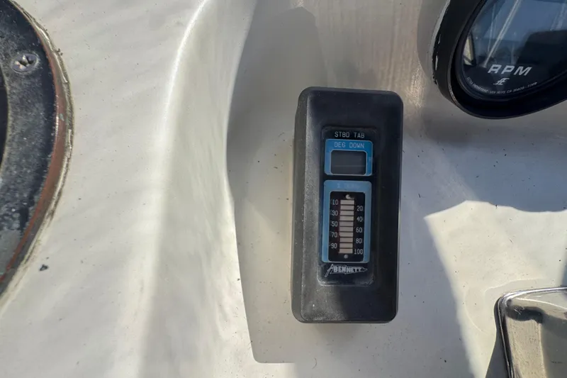 Control panel of a 1977 Tollycraft 37 Convertible boat with RPM gauge.