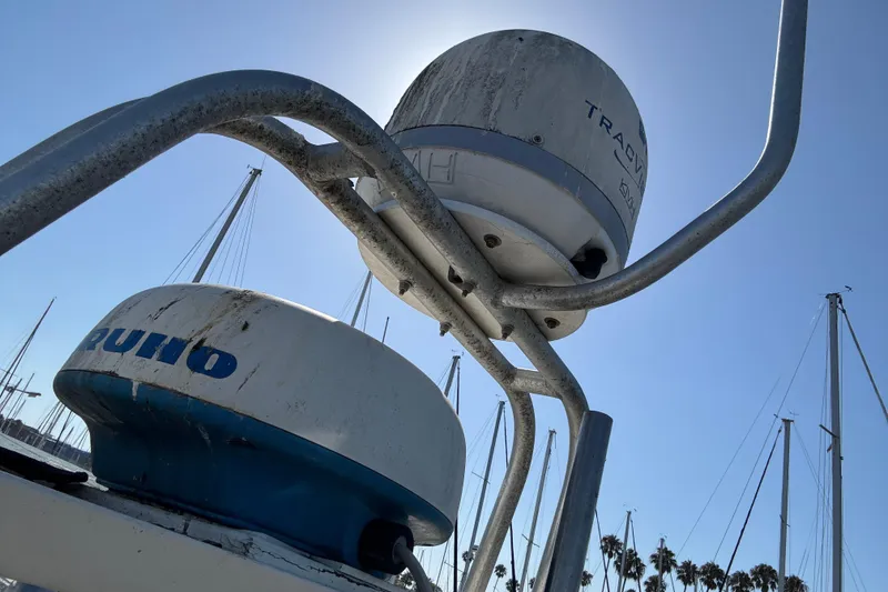 Radar equipment on a 1977 Tollycraft 37 Convertible boat, with clear blue sky background.