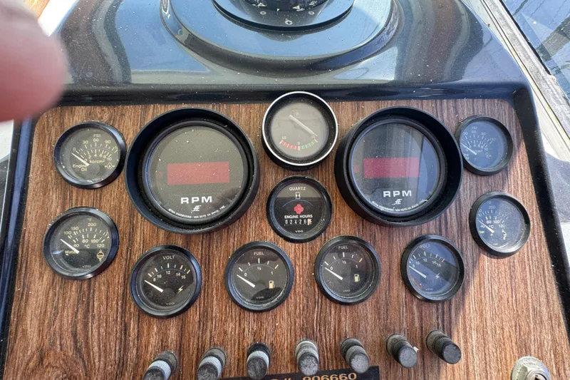 1977 Tollycraft 37 Convertible dashboard with RPM, fuel, and engine gauges.