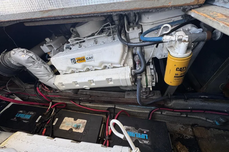 Engine compartment of a 1977 Tollycraft 37 Convertible with CAT 3208 engine.