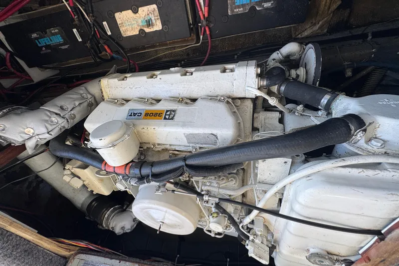 Engine compartment of a 1977 Tollycraft 37 Convertible with CAT 3208 engine.