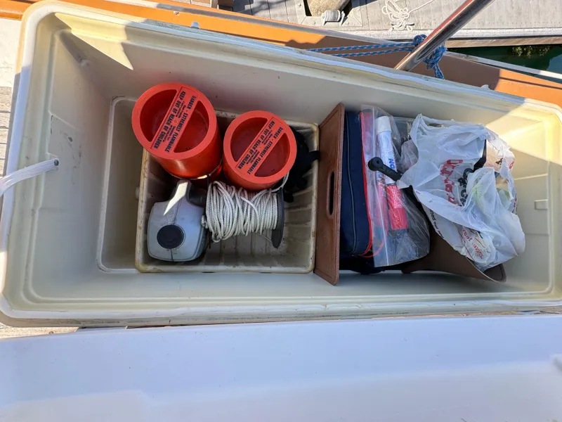 Storage compartment on 1984 Transpacific Marine Ketch with marine equipment and supplies.