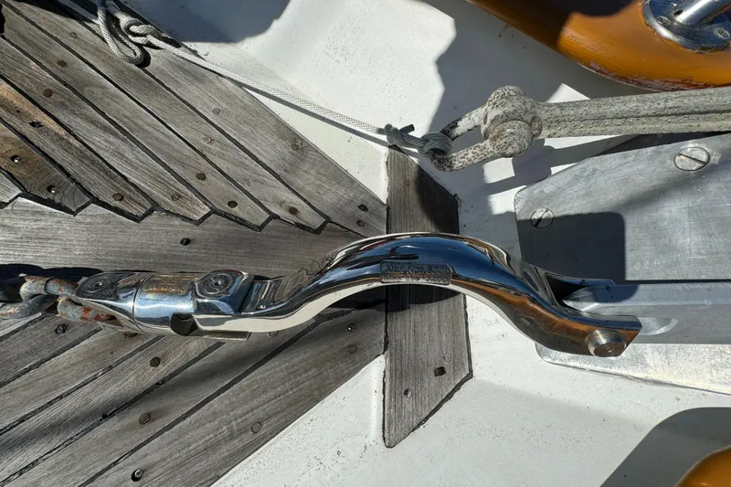 Close-up of 1984 Transpacific Marine Ketch deck hardware and wood detailing.