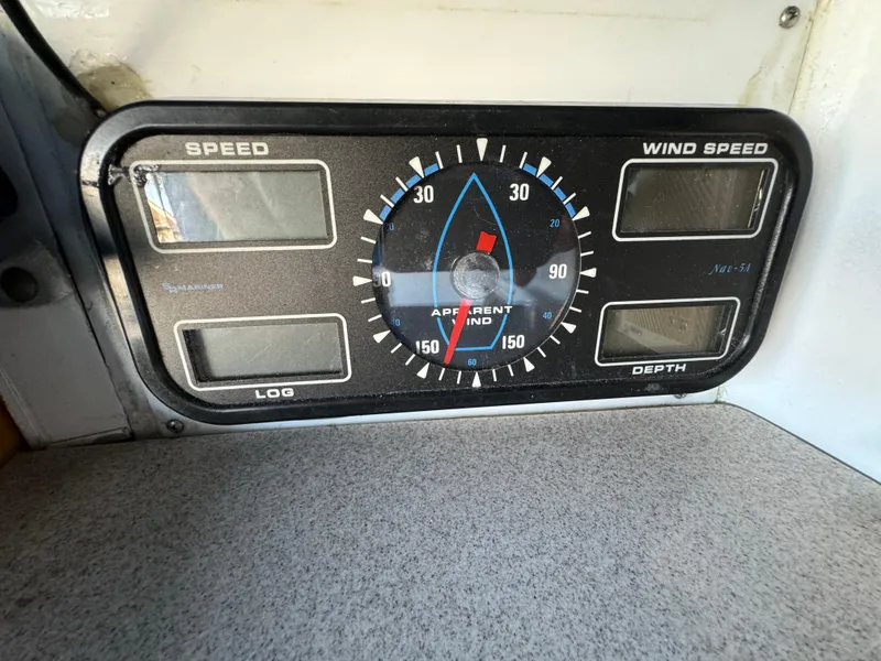 Instrument panel on a 1984 Transpacific Marine Ketch showing speed, wind speed, and depth gauges.