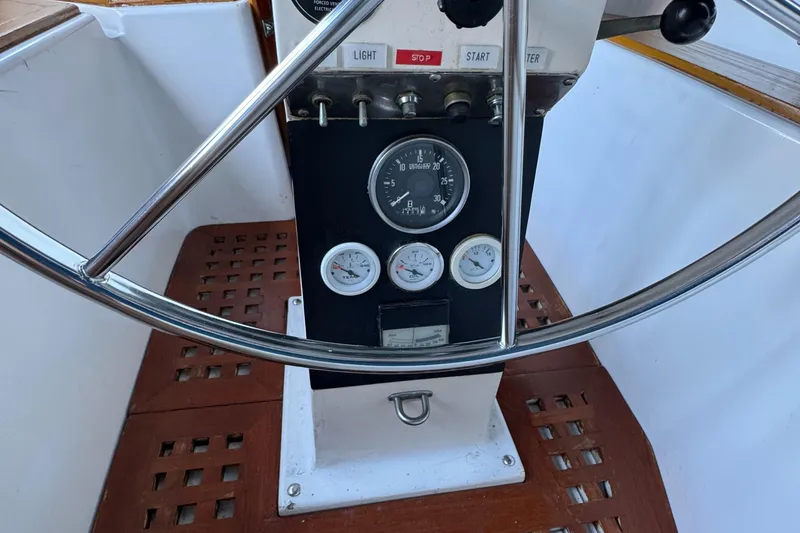 1984 Transpacific Marine Ketch steering wheel and instrument panel close-up.