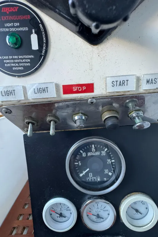 Control panel of a 1984 Transpacific Marine Ketch with gauges and switches.