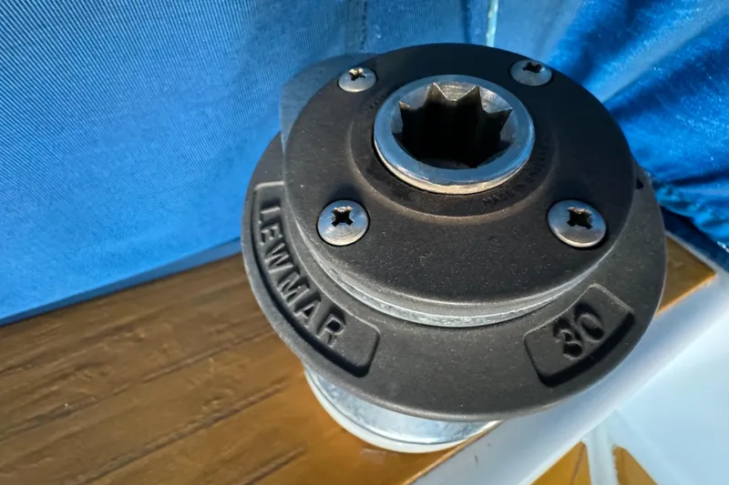 Lewmar winch on 1984 Transpacific Marine Ketch, against blue fabric background.