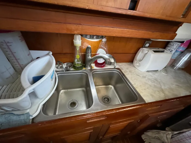 1984 Transpacific Marine Ketch kitchen area with double sink.