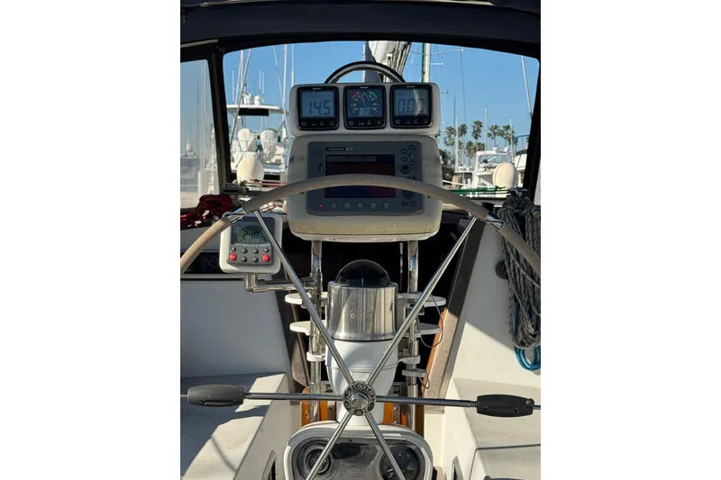Cockpit view of a 1989 Catalina 42 sailboat with navigation instruments.