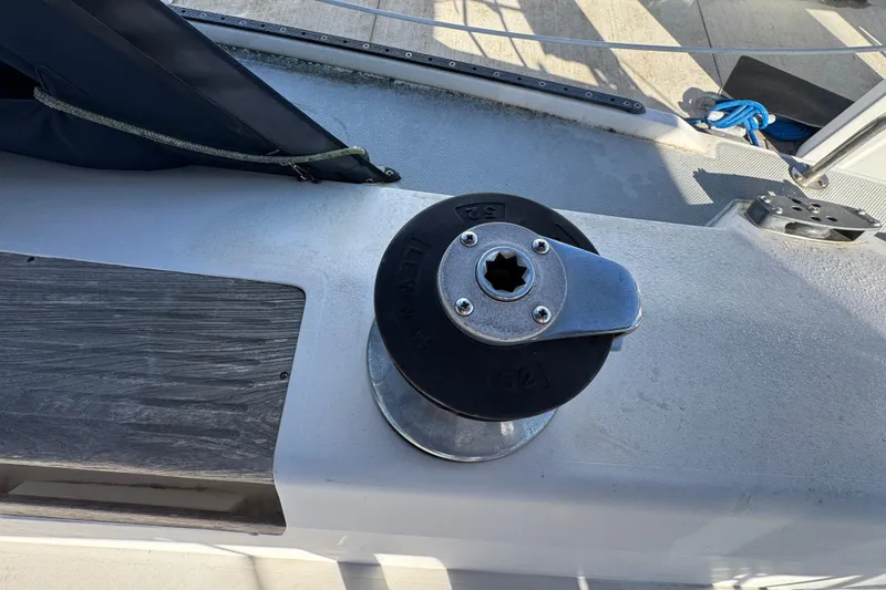 Winch on 1989 Catalina 42 sailboat deck, featuring Lewmar 52 model.