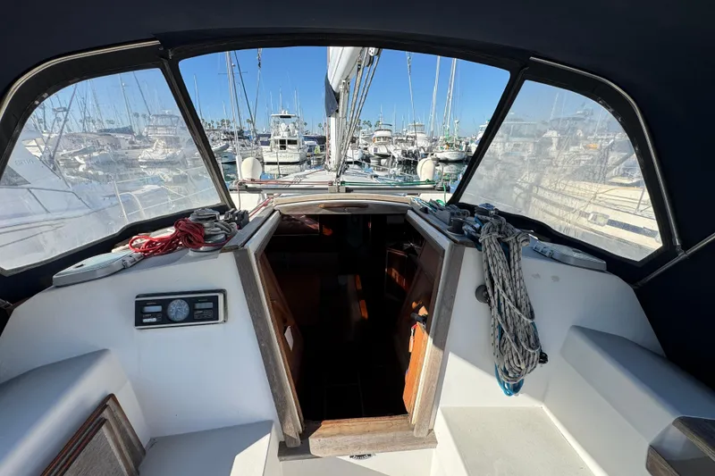 Cockpit view of 1989 Catalina 42 sailboat docked at marina.