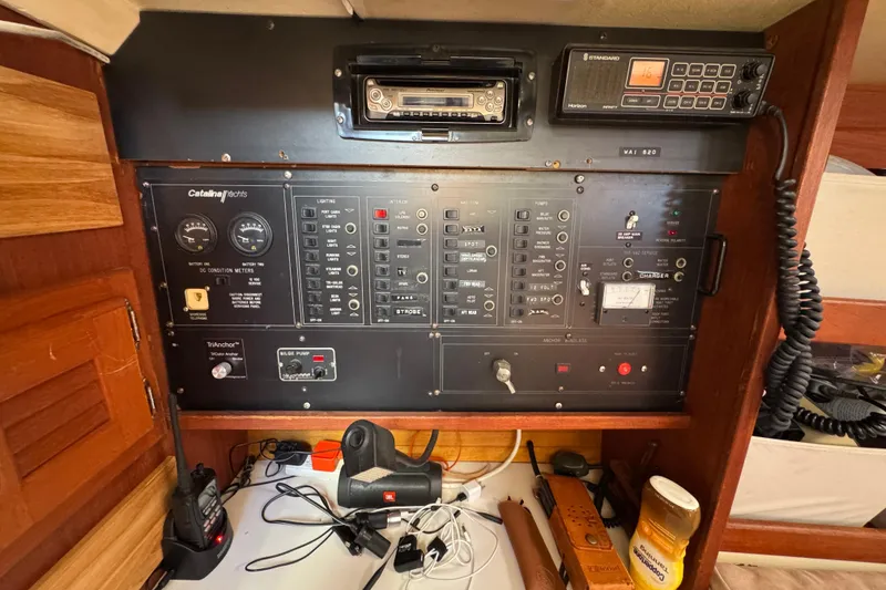 Electrical control panel of a 1989 Catalina 42 yacht with various switches and meters.