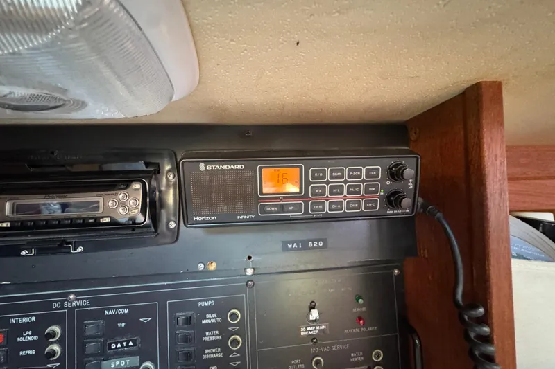 Control panel of a 1989 Catalina 42 sailboat with radio and navigation equipment.