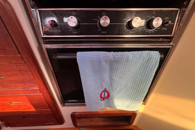 Boat kitchen with Princess stove, blue towel, Catalina 42, 1989 model.