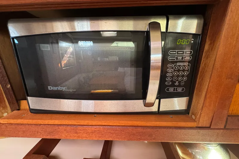 Danby Designer microwave in a 1989 Catalina 42 yacht kitchen setting.
