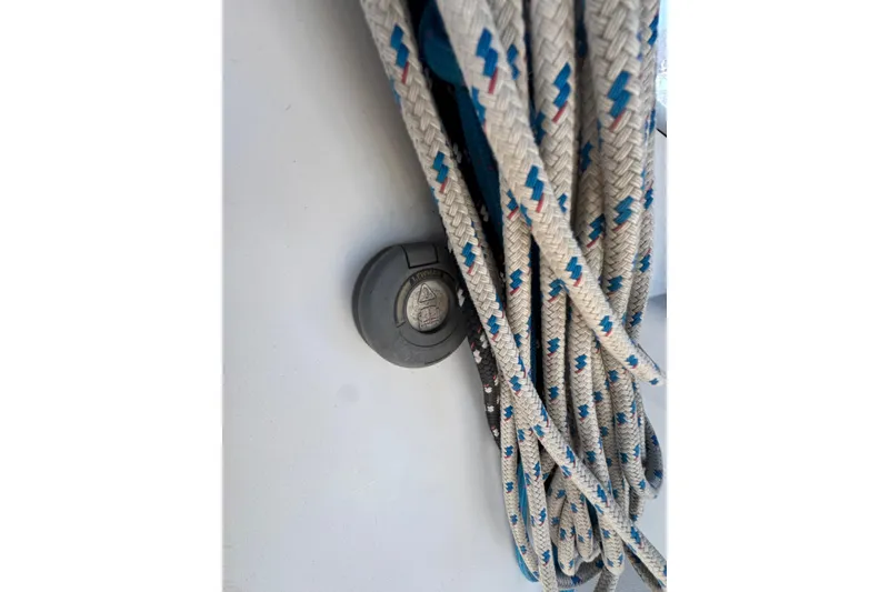 Close-up of Catalina 42 sailboat ropes, 1989 model, with a deck fitting.