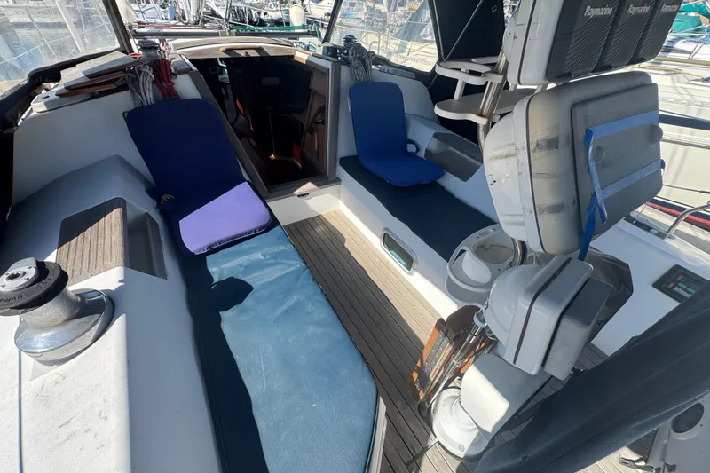 Cockpit of a 1989 Catalina 42 sailboat with seating and navigation equipment.