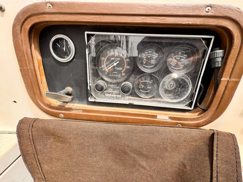 Instrument panel of a 1978 Islander 36 sailboat with gauges and controls.