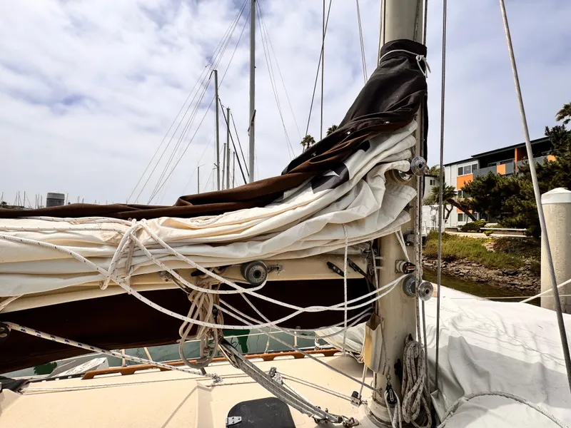 1978 Islander 36 sailboat with neatly folded sails and rigging at a marina.