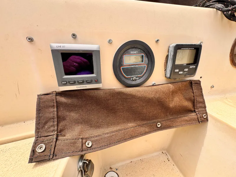1978 Islander 36 sailboat dashboard with Garmin, Signet, and Standard Horizon instruments.