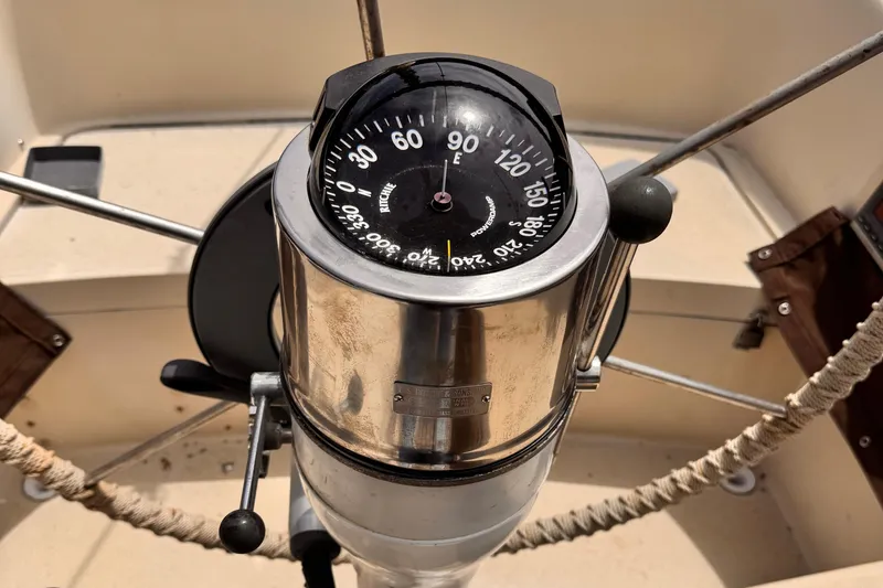 Compass on 1978 Islander 36 sailboat, showing eastward direction.
