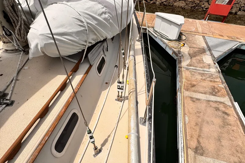 1978 Islander 36 sailboat docked, showing deck details and rigging.