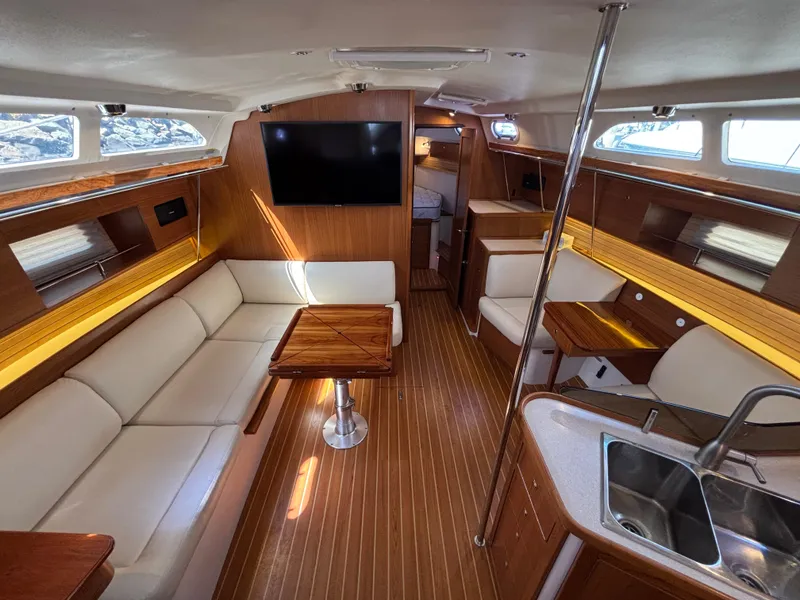 Luxurious interior of a 2019 Catalina 385 sailboat with modern amenities and elegant wood finishes.