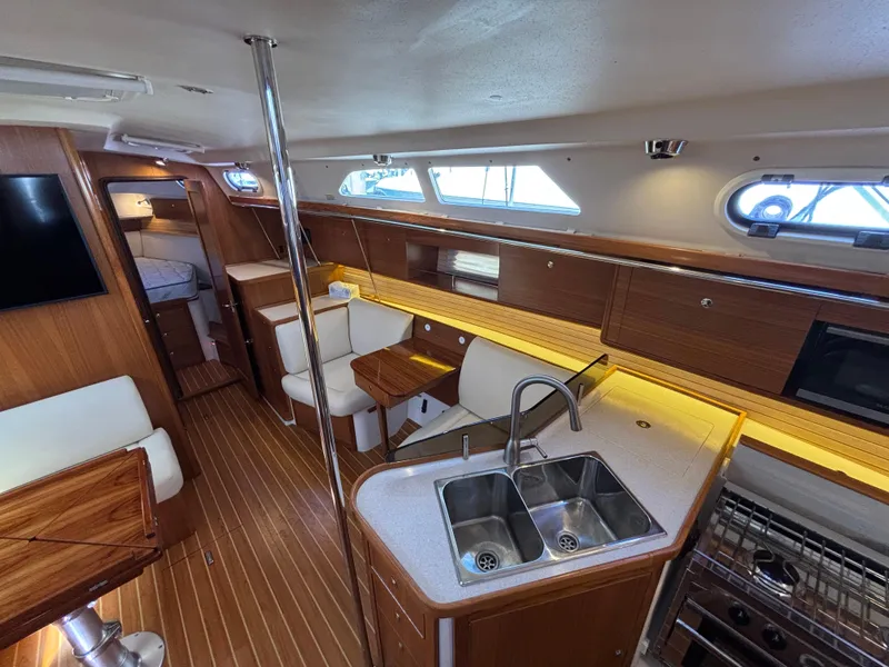 Interior of 2019 Catalina 385 sailboat with modern kitchen and seating area.