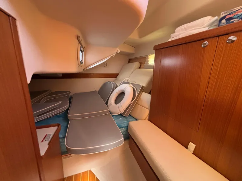 2019 Catalina 385 yacht interior with wooden cabinets and cushioned seating.