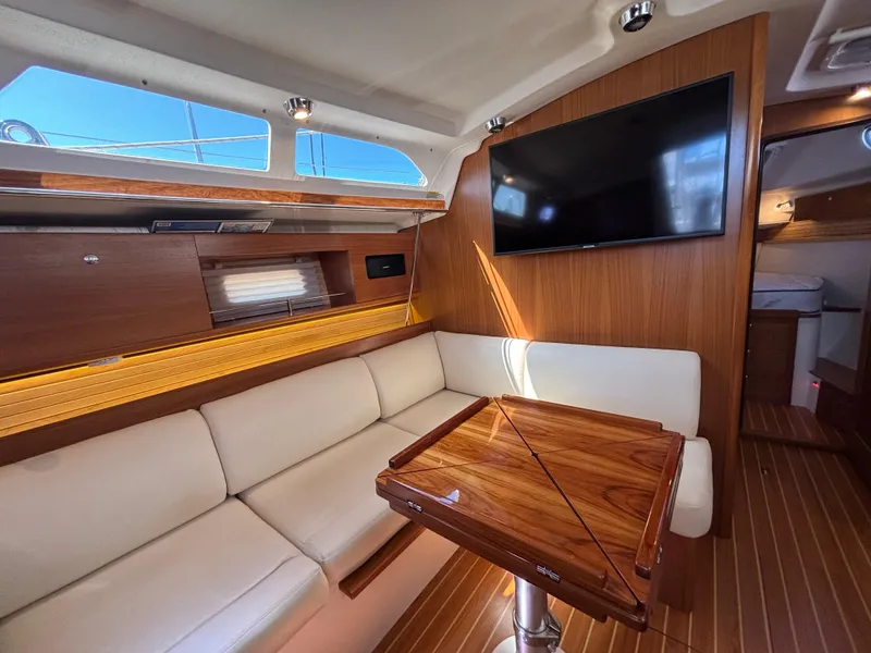 Interior of 2019 Catalina 385 yacht with modern seating and wooden finishes.