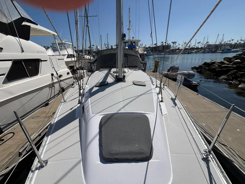 2019 Catalina 385 sailboat docked at a marina, surrounded by other boats.