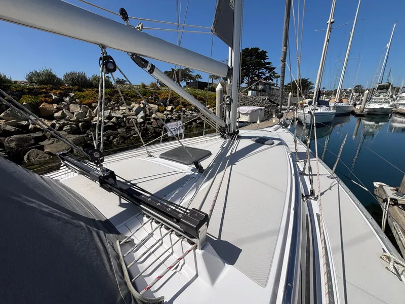 2019 Catalina 385 sailboat deck view in marina, showcasing rigging and sleek design.