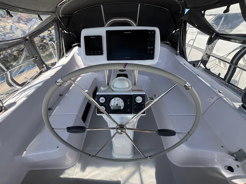 Cockpit of 2019 Catalina 385 sailboat with steering wheel and navigation instruments.